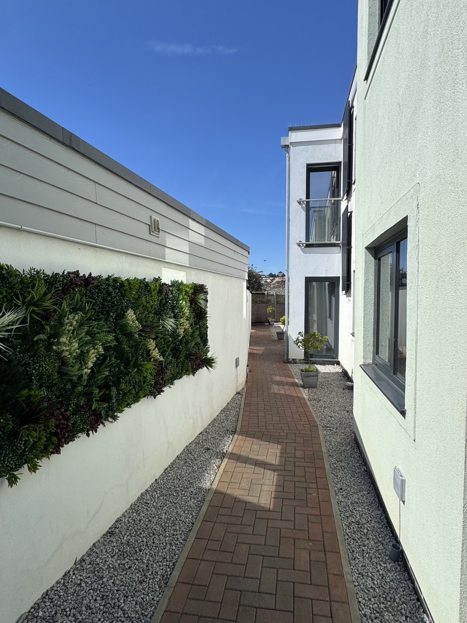 Walkway with green wall